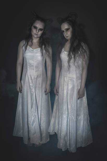 Two terrible ghost with horns on dark Two terrible ghost with horns on dark background ugly girl stock pictures, royalty-free photos & images