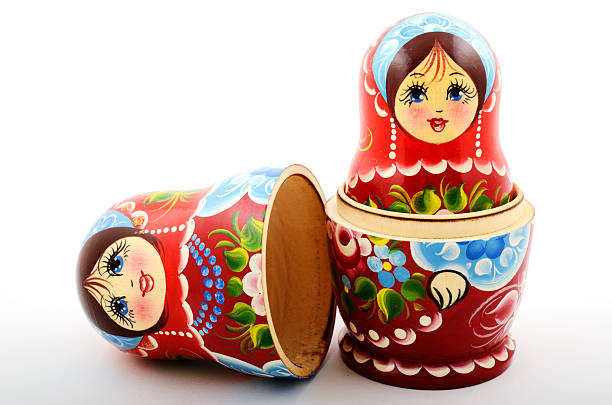 two traditional Russian matryoshka dolls two traditional Russian matryoshka dolls on white background russian nesting doll stock pictures, royalty-free photos & images