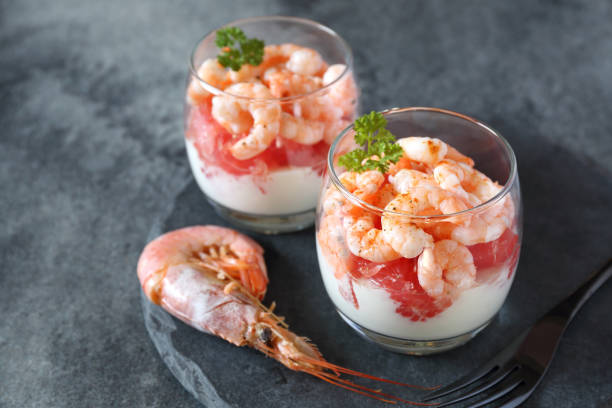 Two verrines for appetizer. Shrimp with grapefruit and cream stock photo