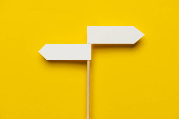 Two Way Two directional sign on the yellow background. directional sign stock pictures, royalty-free photos & images