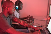 istock Two young black male gamers playing at station 1372341670