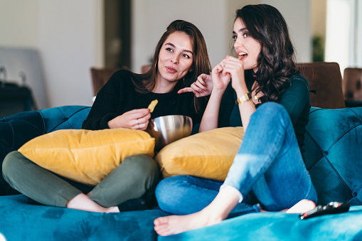Two Young Women Friends Watching Tv At Home Stock Ph wife image Two Young Women Friends Watching Tv At Home Stock Ph