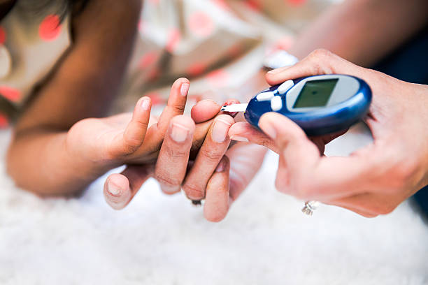 type 1 diabetes management - checking stock-fotos und bilder