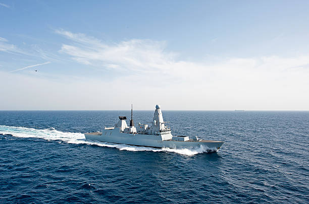 Type 45 at speed, Arabian Sea Arabian Sea, U.A.E. - April 16, 2016: Type 45 destroyer on exercises in the Arabian Sea. Also known as the D or Daring class, the Type 45 is an advanced class of six guided missile destroyers built for the United Kingdom's Royal Navy. The class is primarily designed for anti-aircraft and anti-missile warfare destroyer stock pictures, royalty-free photos & images