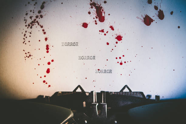 Typewriter spelling horror on blood stained paper Typewriter spelling horror on blood stained paper serial killer stock pictures, royalty-free photos & images