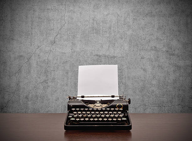 typewriter with blank paper stock photo