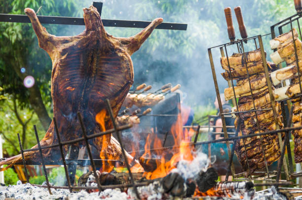 Typical barbecue from the south of Latin America. Meat and vegetable exhibition on a barbecue known as Parrilla. Typical barbecue from the south of Latin America. argentina food stock pictures, royalty-free photos & images