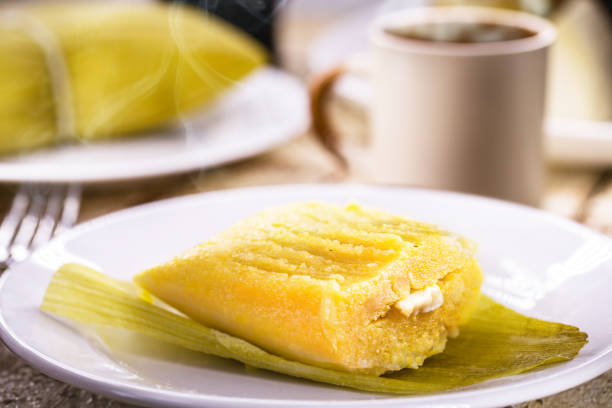 Typical Brazilian sweet pamonha made with corn and stuffed with cheese, served hot. Traditional food from Minas Gerais state stock photo
