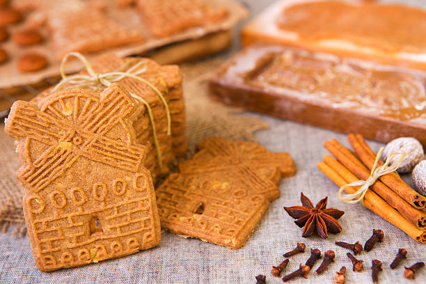 Typical Dutch speculaas cookies with authentic wooden cookie cutters stock photo