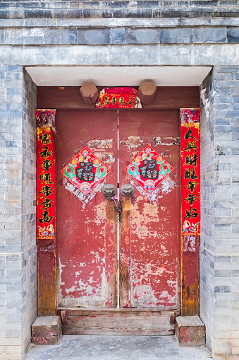 Typical old-time rural residential building in northern China, with decoration at the entrance of the residence.