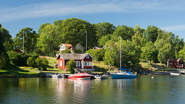 Typical red and yellow Swedish houses in a bay stock photo