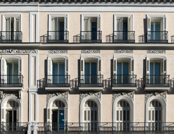 Typical windows and balconies in a house in Madrid stock photo