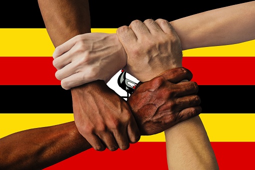 uganda flag, intergration of a multicultural group of young people.