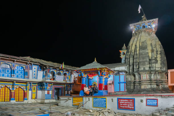 Ukhimath temple at Rudraprayag, Uttarakhand, India UKHIMATH, RUDRAPRAYAG, UTTARAKHAND, INDIA - OCTOBER 30 2018 : Ukhimath, sacrd hindu temple under the night sky. Winter puja of Lord Kedarnath and year-round puja of Lord Omkareshwar is performed here. kedarnath temple stock pictures, royalty-free photos & images