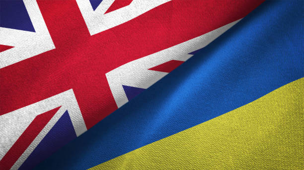 Ukraine and United Kingdom two flags together realations textile cloth fabric texture stock photo