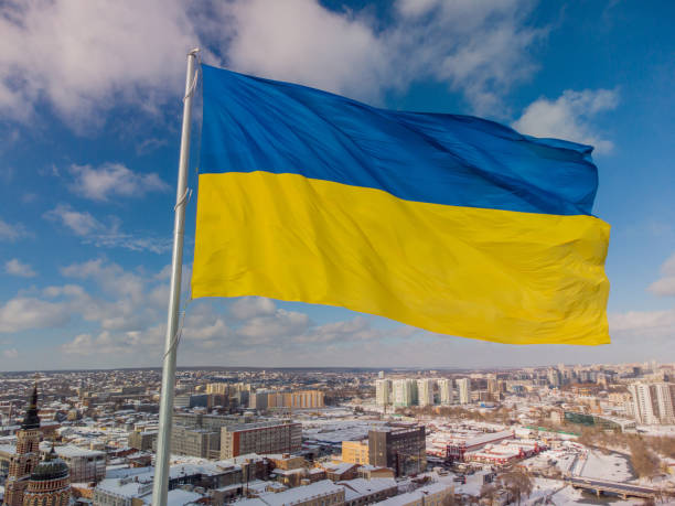Ukrainian flag in the wind. Blue Yellow flag in the city of Kharkov stock photo