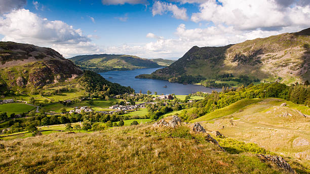 Ullswater at Glenridding Ullswater lake curves through the mountains of the English Lake District at Glenridding, looking down on the lake from the crags of Birkhouse Moor. cumbria stock pictures, royalty-free photos & images