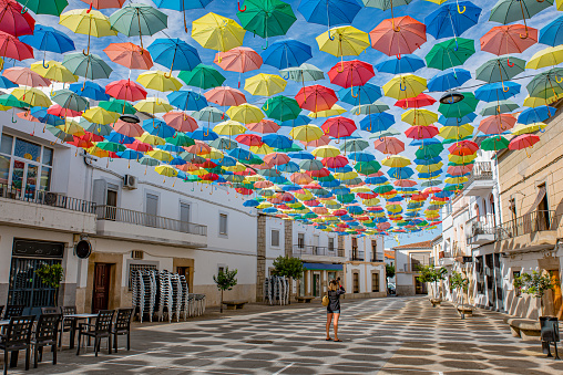 Agueda, Portugal - August 10, 2019: Colourful umbrellas hanging in the sky at the festivities in the village of Agueda