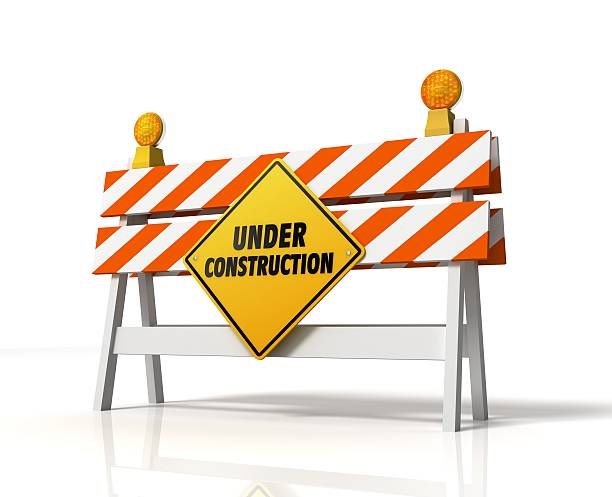 Under construction sign on a white background stock photo