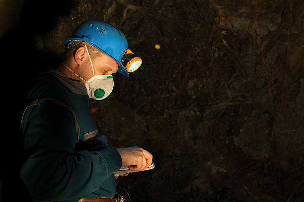 Underground worker Underground worker, geologist, miner wearing safety equipment. geologist stock pictures, royalty-free photos & images