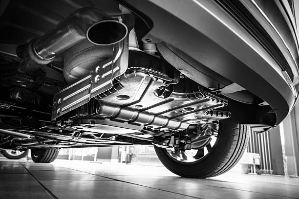Underneath a car Underneath a car exhaust pipe stock pictures, royalty-free photos & images