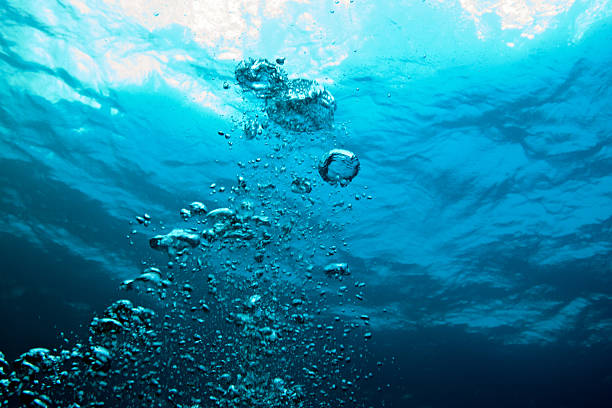 underwater bubbles stock photo