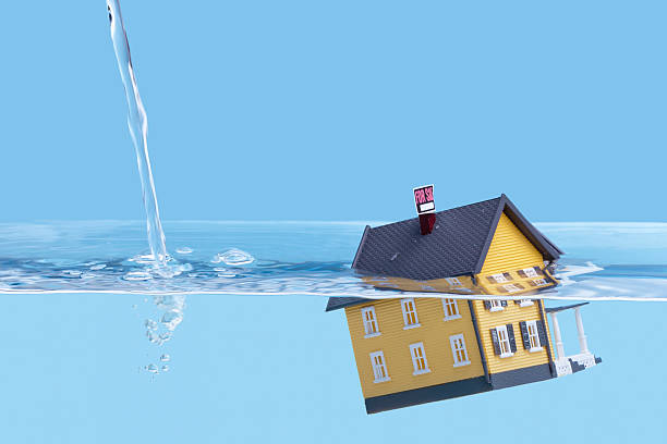 Underwater home mortgage, house for sale Real estate or home mortgage crisis concept, copy space. Please check out my other real estate concept images in my portfolio. Thanks! foreclosure stock pictures, royalty-free photos & images