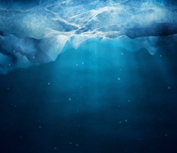 Underwater picture of sunbeams through layer of ice Underwater scene under the arctic ice. 3D renderd with HDRI lightening and high detaild. iceberg ice formation stock pictures, royalty-free photos & images