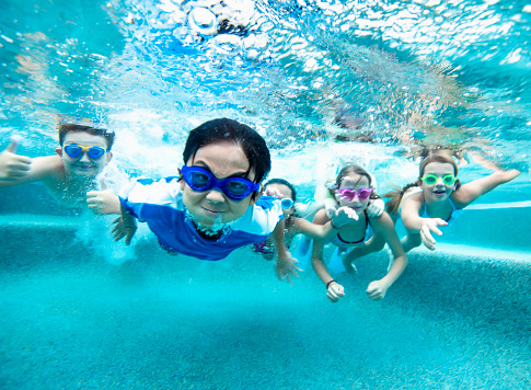 Group of young friends underwater 