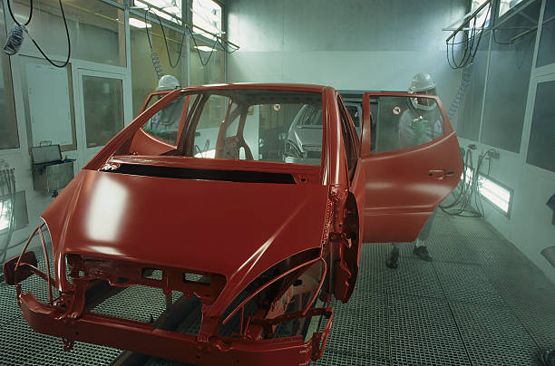 Unfinished frame of red car in auto shop stock photo
