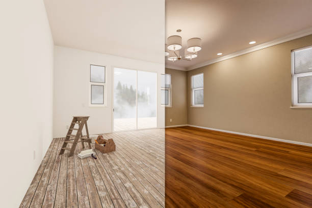 Unfinished Raw and Newly Remodeled Room of House Before and After with Wood Floors, Moulding, Tan Paint and Ceiling Lights. stock photo
