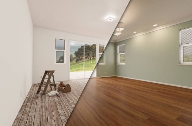 Unfinished Raw and Newly Remodeled Room of House Before and After with Wood Floors, Moulding, Light Green Paint and Ceiling Lights. stock photo