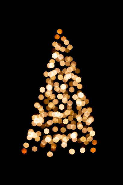 Unfocused Christmas lights on Christmas trees on a black background. Copy Space stock photo