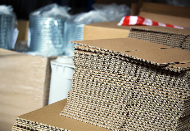 Unfolded cardboards for boxes in the warehouse stock photo