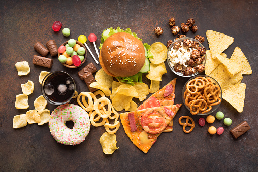 Assortment of Unhealthy Food, top view, copy space. Unhealthy eating, junk food concept.