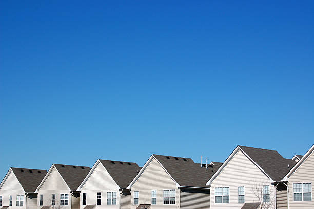 Uniformity in Housing A row of houses (townhouses or condominiums) all looking the same.Also please feel free to review my other multiple housing photos: medium group of objects stock pictures, royalty-free photos & images