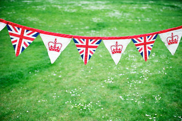 Union Jack Crown Celebratory Bunting Green Grass Royal Baby Decoration stock photo