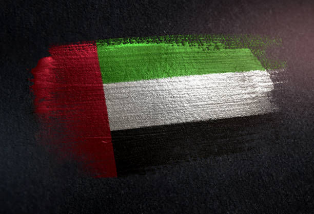 阿拉伯聯合大公國國旗用金屬刷漆塗在黑牆上 - uae flag 個照片及圖片檔