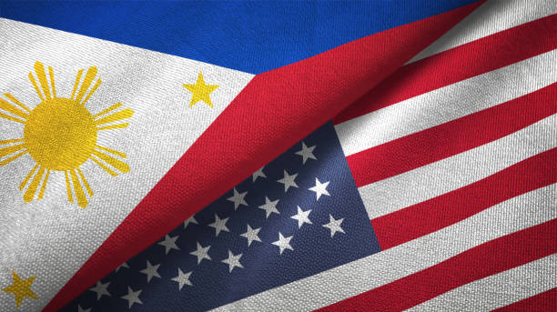 United States and Philippines two flags together textile cloth fabric texture United States and Philippines flag together realtions textile cloth fabric texture philippines stock pictures, royalty-free photos & images