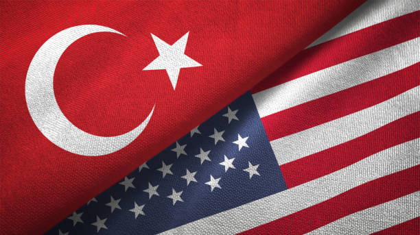 United States and Turkey two flags together textile cloth fabric texture stock photo