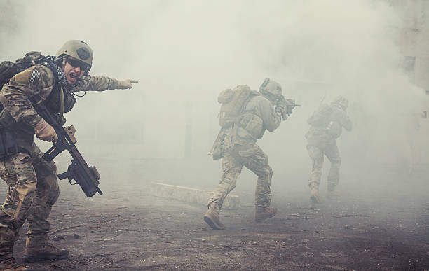 United States Army rangers in action United States Army rangers during the military operation in the smoke and fire conflict photos stock pictures, royalty-free photos & images