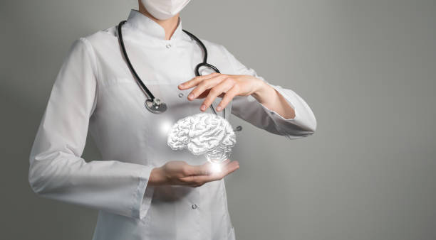 Unrecognizable doctor holding highlighted handrawn Brain in hands. Medical illustration, template, science mockup. stock photo