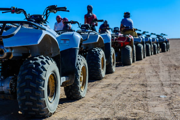 Unrecognizable people near quad bikes during safari trip in Arabian desert not far from the Hurghada city, Egypt Unrecognizable people near quad bikes during safari trip in Arabian desert not far from Hurghada city, Egypt hot egyptian women stock pictures, royalty-free photos & images
