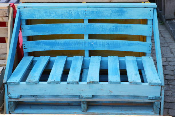 Unusual bench done with recycled wooden pallets stock photo