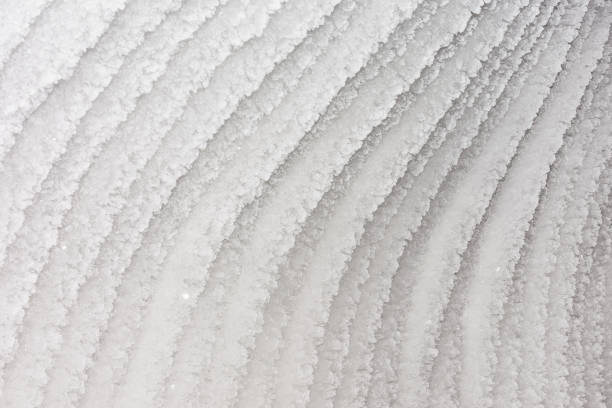 Unusual ice patterns. Crystals of snow in stripes stock photo