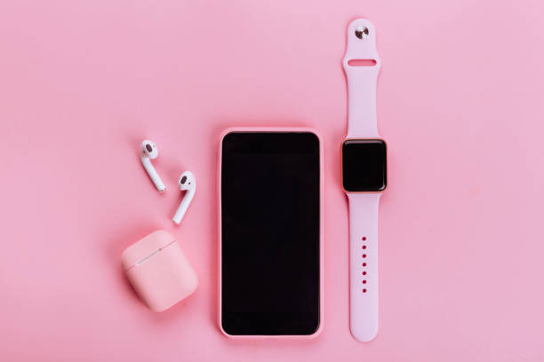 Up to date technology.Top view of diverse personal accessory Up to date technology.Top view of diverse personal accessory laying on the pink background personal accessory stock pictures, royalty-free photos & images
