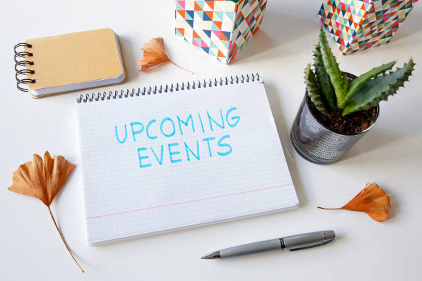 upcoming events written in a notebook stock photo