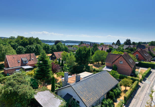 Urban area in Svendborg with detached houses High point view from Svendborgsund bridge in Svendborg. Urban area in Svendborg. Detached houses close to the sea "Svendborgsund" denmark stock pictures, royalty-free photos & images