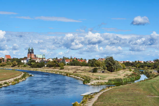 Urban landscape with river Warta and the cathedral towers Urban landscape with river Warta and the cathedral towers  in Poznan poznan stock pictures, royalty-free photos & images