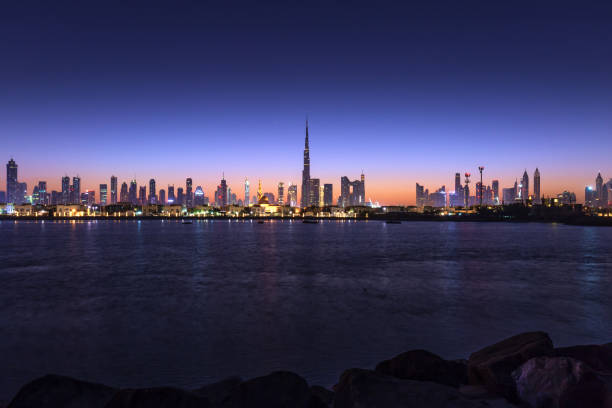 Urban Skyline and modern skyscrapers in Dubai UAE at sunrise. stock photo